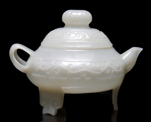 In January, this translucent jade teapot with lotus finial and vines in relief on the sides brought $19,520 at Leslie Hindman's auction in Chicago. Courtesy Leslie Hindman Auctioneers